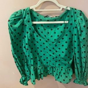 Green and black polka dot top